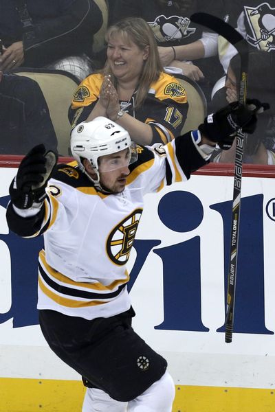 The Bruins’ Brad Marchand celebrates one of his two first-period goals. (Associated Press)