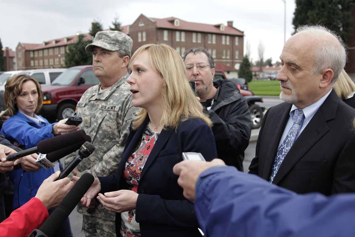 Emma Scanlan, center, the civilian defense attorney for U.S. Army Staff Sgt. Robert Bales, talks to reporters, Tuesday Nov. 13, 2012, as she stands with Bales