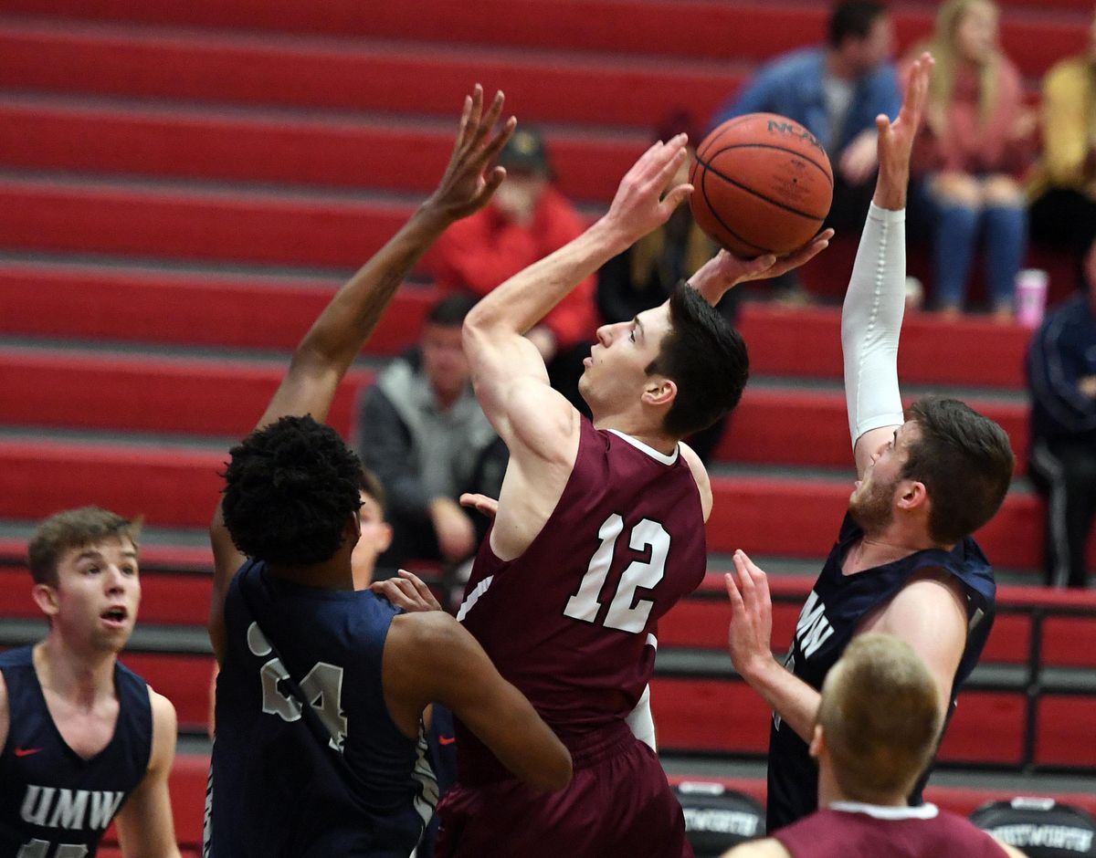 Whitworth’s Sam Lees looks to score between Mary Washington’s Trey Barber, left, and Drew Johnson during first-half action on Monday night. (Colin Mulvany / The Spokesman-Review)