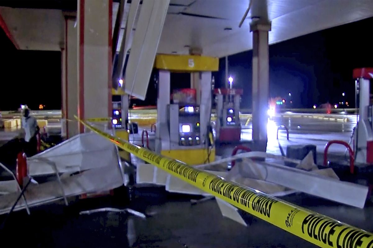 In this image made from video, debris from tornadoes pile around the pumps of a filling station late Sunday, Oct. 10, 2021, in Shawnee, Oklahoma. Several reported tornadoes ripped through Oklahoma late Sunday into early Monday morning, causing damage but no immediate word of deaths or injuries.  (HONS)