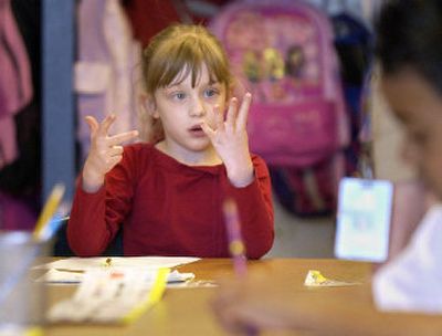 
Liberty Lake Elementary kindergartner Samantha Stevens works on a math problem in her class Monday. Kindergartens will be closed at Liberty Lake and Greenacres elementaries next fall.
 (Liz Kishimoto / The Spokesman-Review)