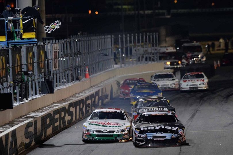 Cameron Hayley (inside, black) beats Gray Gaulding (outside, white) to the K&N Pro Series checkered flag. (Photo Credit: Getty Images for NASCAR) (John Harrelson / Nascar)