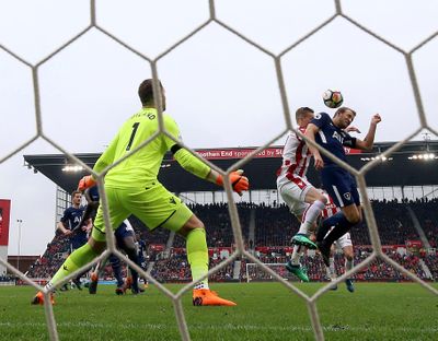 In this April 7, 2018, file photo, Tottenham Hotspur’s Harry Kane, right, attempts to get a touch on his side’s second goal scored by teammate Christian Eriksen during the English Premier League soccer match against Stoke City in, England. Kane appealed to the FA that he had the final touch on the ball before it went in. On Wednesday, April 12, the league agreed and awarded the goal to Kane. (Nigel French / PA via AP)