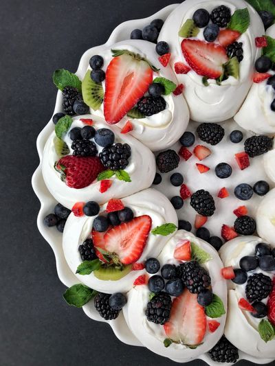 Seasonal berries make this cloud-like pavlova perfect any time of the year. (Audrey Alfaro)