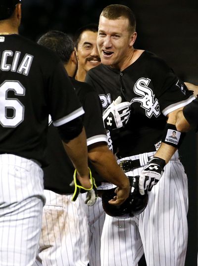 Chicago White Sox’s Todd Frazier, right, celebrates with teammates after driving in the winning run against the Seattle Mariners during the ninth inning in Chicago on Thursday night. (Nam Y. Huh / Associated Press)