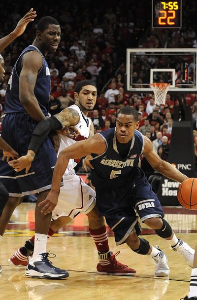 Georgetown’s Markel Starks, right, used a big second half for a career-high 20 points to drive the Hoyas past Louisville. (Associated Press)