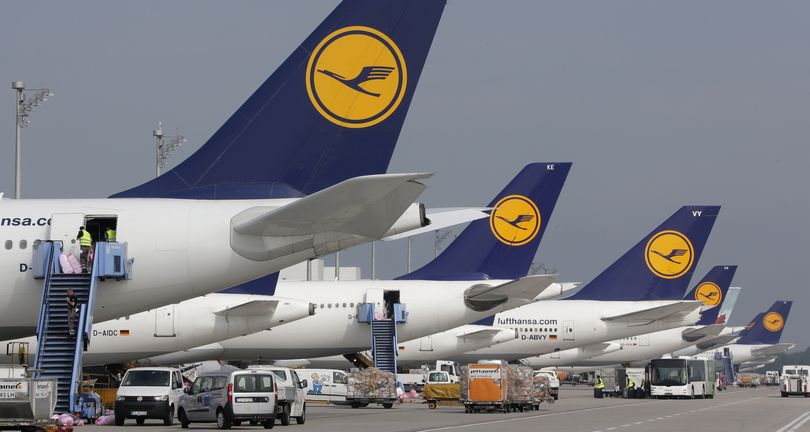 Airport employees prepare aircrafts of the airliner Lufthansa at the airport during an eight-hour warning strike of Lufthansa pilots in Munich, southern Germany, Wednesday, Sept. 10, 2014. (Matthias Schrader / Associated Press)