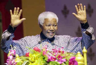 
Nelson Mandela acknowledges the audience while making a speech at the 15th International AIDS Conference Thursday in Bangkok, Thailand.
 (Associated Press / The Spokesman-Review)