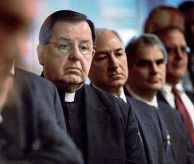 
The Rev. Dennis J. O'Donovan, center, vicar general of the Portland Archdiocese, looks on during a news conference Monday on a plan to bring the arch- diocese out of bankruptcy. 
 (Associated Press / The Spokesman-Review)