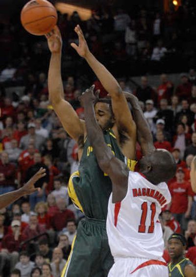 
Oregon's Frantz Dorsainvil tries to pass over Nebraska's Ade Dagunuro. Associated Press
 (Associated Press / The Spokesman-Review)