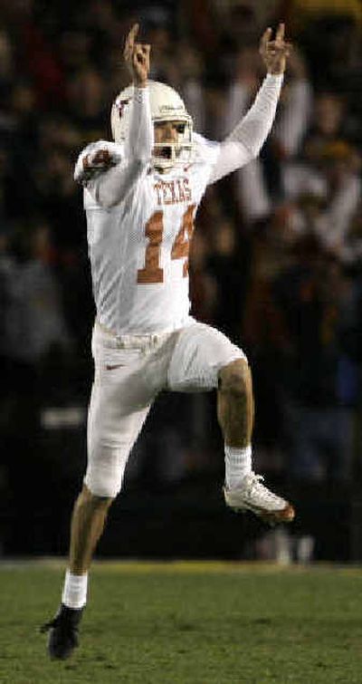 
Texas place-kicker Dusty Mangum celebrates his game-winning field goal in Pasadena. 
 (Associated Press / The Spokesman-Review)