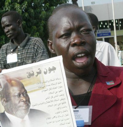 
A weeping supporter holds John Garang's picture.
 (Associated Press / The Spokesman-Review)