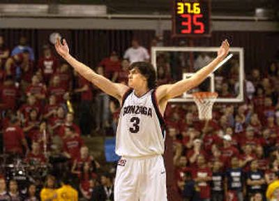Gonzaga forward Adam Morrison revs up the crowd after the Bulldogs' win over Saint Mary's in the WCC tournament championship game Monday night. 
 (Brian Plonka / The Spokesman-Review)