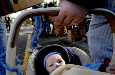 
Uriah Anderson Roth, 5 months old, was in line with his mom, Patty, at Lakes Middle School on Tuesday  for the food giveaway sponsored by  Thrivent Financial for Lutherans,  Second Harvest Inland Northwest and the Lakes Middle School PTA, with help from the Coeur d'Alene School District and other area PTAs. 
 (Kathy Plonka / The Spokesman-Review)