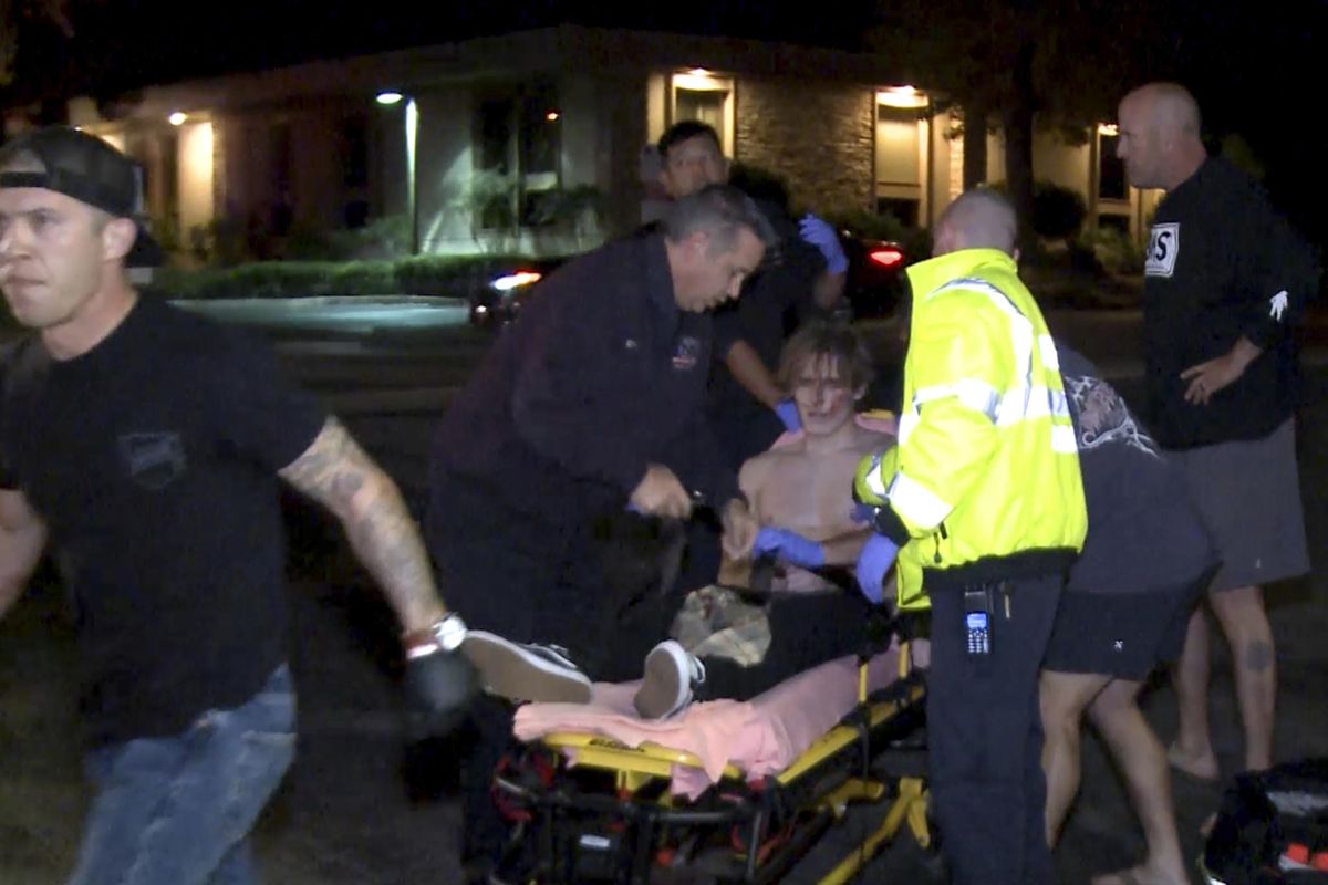 In this image taken from video a victim is treated near the scene of a shooting, Wednesday evening, Nov. 7, 2018, in Thousand Oaks, Calif. (Associated Press)