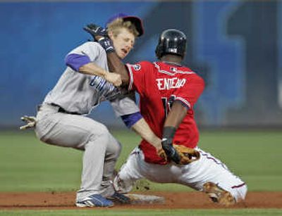 
Braves' Edgar Renteria collides with Cubs' Mike Fontenot.  Associated Press
 (Associated Press / The Spokesman-Review)