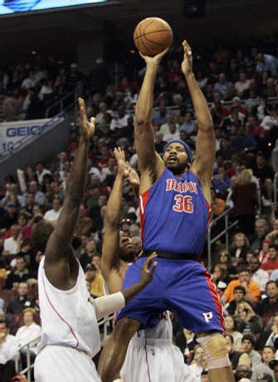 
Detroit's Rasheed Wallace shoots over Reggie Evans during the first quarter. Associated Press
 (Associated Press / The Spokesman-Review)