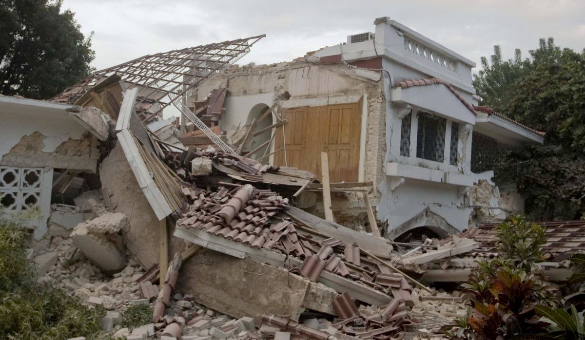 A destroyed building near the Hotel Villa Creole in Port-au-Prince is seen Tuesday after the strongest earthquake in more than 200 years struck Haiti.  (Associated Press)