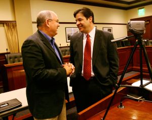 Raul Labrador, candidate for the Republican nomination for Idaho's 1st Congressional District, talks with his press secretary Dennis Mansfield before holding a news conference at the Idaho Statehouse on Tuesday May 4, 2010 in Boise, Idaho.  Labrador says the federal government should send the military to the Mexican border because state-by-state solutions like Arizona's won't be effective. (Joe Jaszewski / The Idaho Statesman)