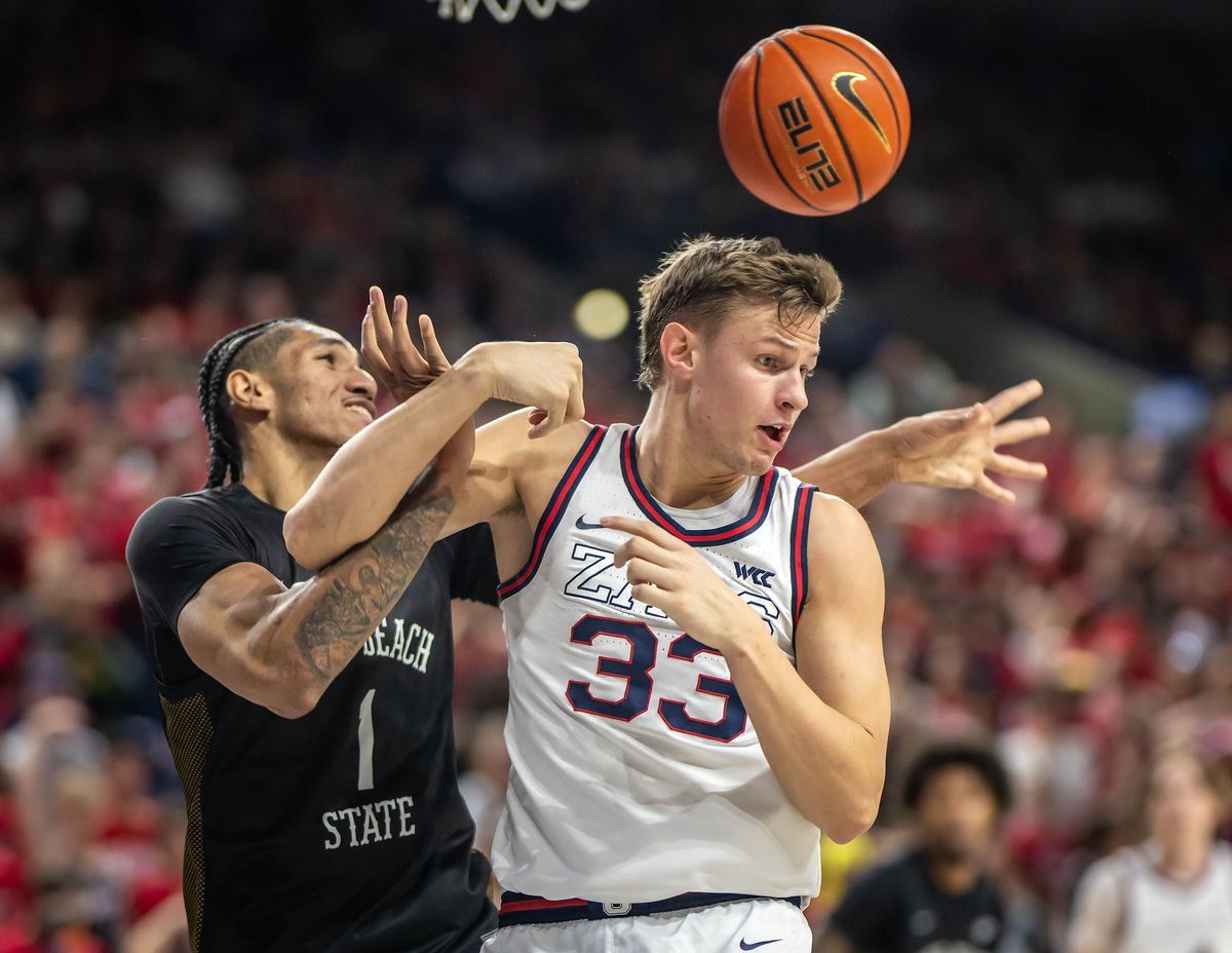 Gonzaga Bulldogs forward Ben Gregg (33) tangles up with Long Beach State forward Derrick Michael Xzavierro (1) during a rebound in the first half of a NCAA college basketball game, Wed., Nov. 20, 2024, at the McCarthey Athletic Center.  (COLIN MULVANY)