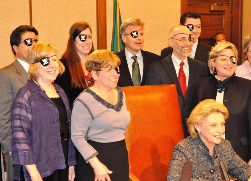 Sen. Lisa Brown and other supporters of a bill outlawing IT piracy donned eye patches after the bill was signed into law on April 18, 2011. (Jim Camden/The Spokesman-Review)