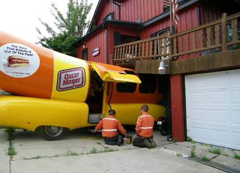 ORG XMIT: WIRAC101 An Oscar Meyer Wienermobile crashed into the home and outdoor deck of Nick Krupp in Racine, Wis. on Friday morning, July 17, 2009. According to a witness, the vehicle was parked in the driveway. The driver lurched the vehicle forward instead of backing out of the driveway, hitting Krupp's deck and cracking the foundation of his house. (AP Photo/Journal Times, Tom McCauley) (Tom Mccauley / The Spokesman-Review)
