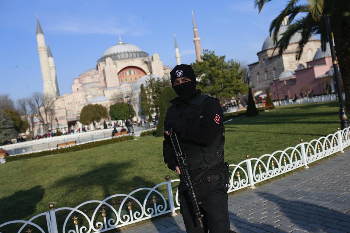 A Turkish police officer patrols the area by the Byzantine-era Hagia Sophia, one of Istanbul’s main tourist attractions, in Istanbul on Wednesday, Jan. 4, 2017. (Emrah Gurel / Associated Press)