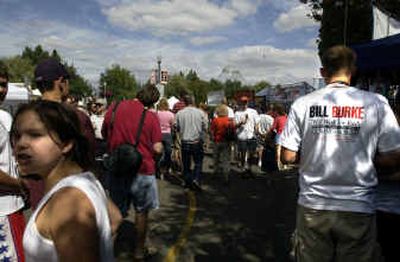 
Pig Out In the Park organizer Bill Burke had T-shirts made to encourage voters to vote for him in this year's election for county commissioner. 
 (Jed Conklin / The Spokesman-Review)