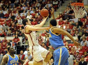 Taylor Rochestie drives past UCLA’s Josh Shipp for a layin to tie the game at 53, but UCLA hangs on for the 61-59 win. (Jesse Tinsley / The Spokesman-Review)