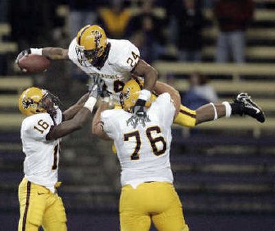 
Arizona State's Keegan Herring (24) celebrates with teammates after scoring a TD on a 65-yard run during the third quarter.
 (Associated Press / The Spokesman-Review)