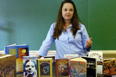 
Charlene Haviland, a science teacher at Northside Middle School in Norfolk, Va., talks in her classroom about her plans to teach a science class based on the popular Harry Potter childrens book series. The Potter novels, several of which are in the foreground, will be included in a voluntary after-school remedial program for eighth-graders that Haviland will teach in the fall.
 (Associated Press / The Spokesman-Review)