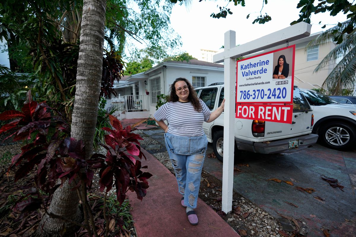 Krystal Guerra, 32, poses for a picture outside her apartment, which she has to leave after her new landlord gave her less than a month