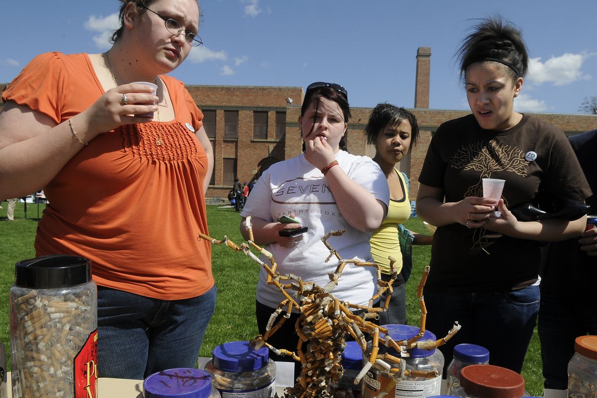 Havermale High School students Devony Audet, left, Melanie Azure, Lydia Johnson and Naiombi Jones view a cigarette-butt tree made by students for an Earth Day presentation at the school, April 24, 2009 in Spokane. Students collected the butts from the school grounds. (Dan Pelle / The Spokesman-Review)