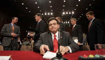 
Attorney General Alberto Gonzales takes his seat at the witness table on Capitol Hill. Associated Press photos
 (Associated Press photos / The Spokesman-Review)