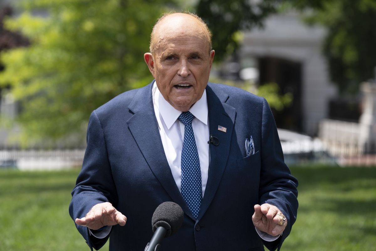 Rudy Giuliani, a personal attorney for President Donald Trump, talks with reporters outside the White House on July 1 in Washington.  (Evan Vucci)