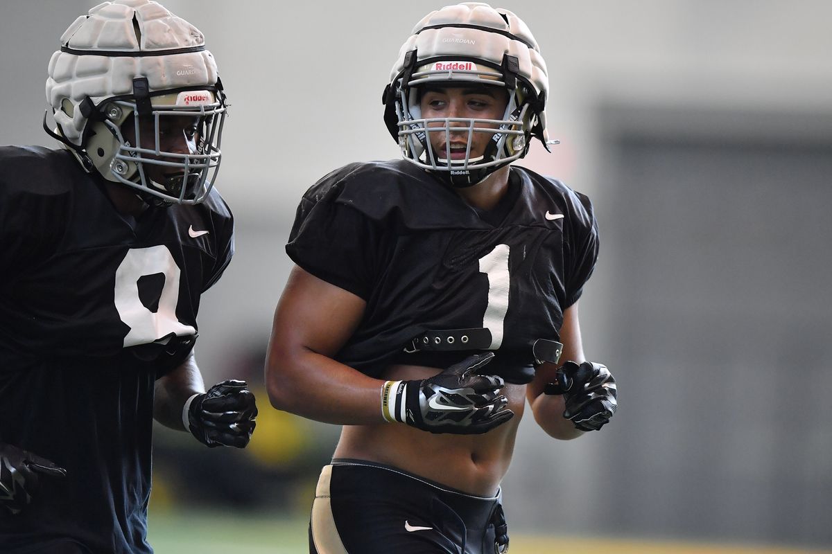 Idaho Vandals linebackers Christian Elliss, right,  (Tyler Tjomsland/THE SPOKESMAN-REVIEW)