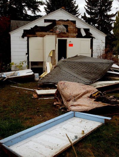 
An early morning natural gas explosion blew the back porch off of a home on Garden Avenue in Coeur d'Alene on Wednesday. The home is vacant. 
 (Kathy Plonka / The Spokesman-Review)