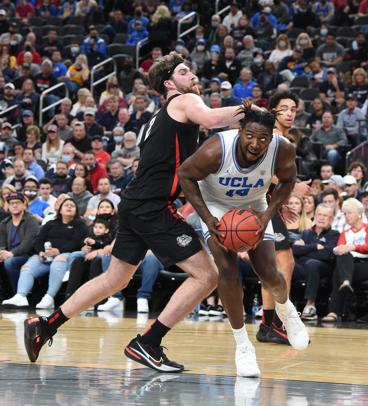 Gonzaga’s Drew Timme defends UCLA’s Kenneth Nwuba under the basket during Tuesday’s Empire Classic in Las Vegas.  (Jesse Tinsley/The Spokesman-Review)