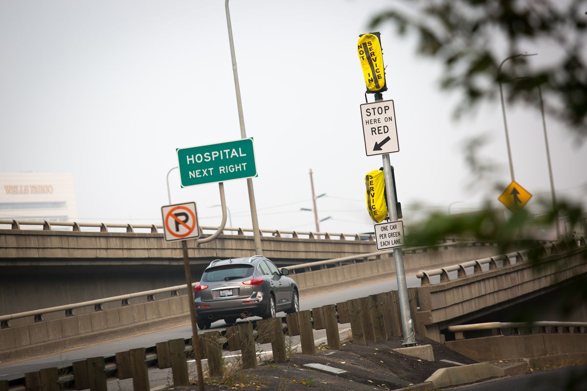 A vehicle passes a ramp meter not yet in use while taking the eastbound on-ramp to I-90 near Fifth and Walnut. This is one of several downtown interstate on-ramps that WSDOT recently equipped with ramp meters.  (Libby Kamrowski/ THE SPOKESMAN-REVIEW)