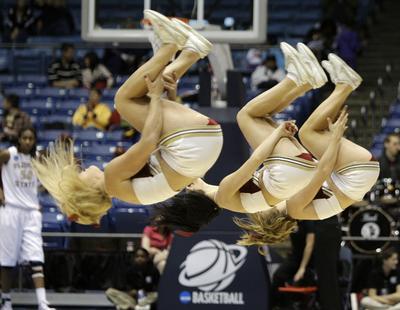 The Florida State cheerleaders perform in the first half of an NCAA Dayton Regional semifinal college basketball game against Mississippi State Sunday, March 28, 2010, in Dayton, Ohio. (Al Behrman / Associated Press)
