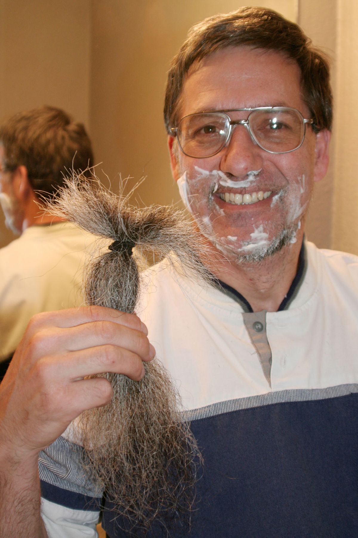 Middle school teacher Gary Weddle, 50, East Wenatchee, Wash., displays his cut beard while shaving the remaining stubble Sunday, May 1, 2011. He completed a vow made nearly 10 years ago not to shave until Osama Bin Laden was captured or proven killed. (Dan Wheat / The Wenatchee World/Capital Press)