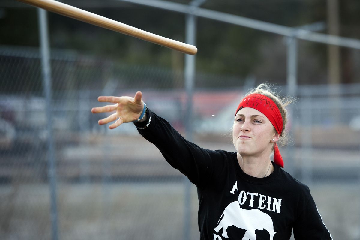 Spartan Race competitor Alyssa Hawley works on her spear throwing abilities. The object of the event is to make the spear stick in the target from a distance of 10-20 yards. (Dan Pelle / The Spokesman-Review)