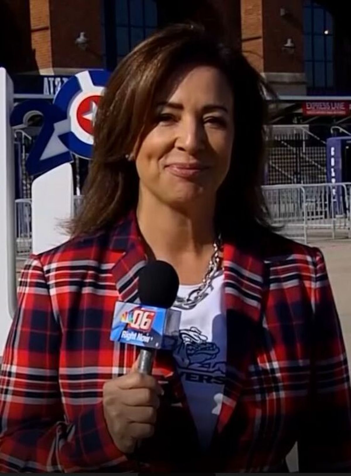 KHQ news anchor Stephanie Vigil wears a red, white and blue plaid jacket while covering the NCAA men’s basketball tournament in 2021. Vigil said she now has a pair of pants to match the jacket, but will only wear them together if the Bulldogs can return to the national championship game.  (Courtesy Stephanie Vigil)