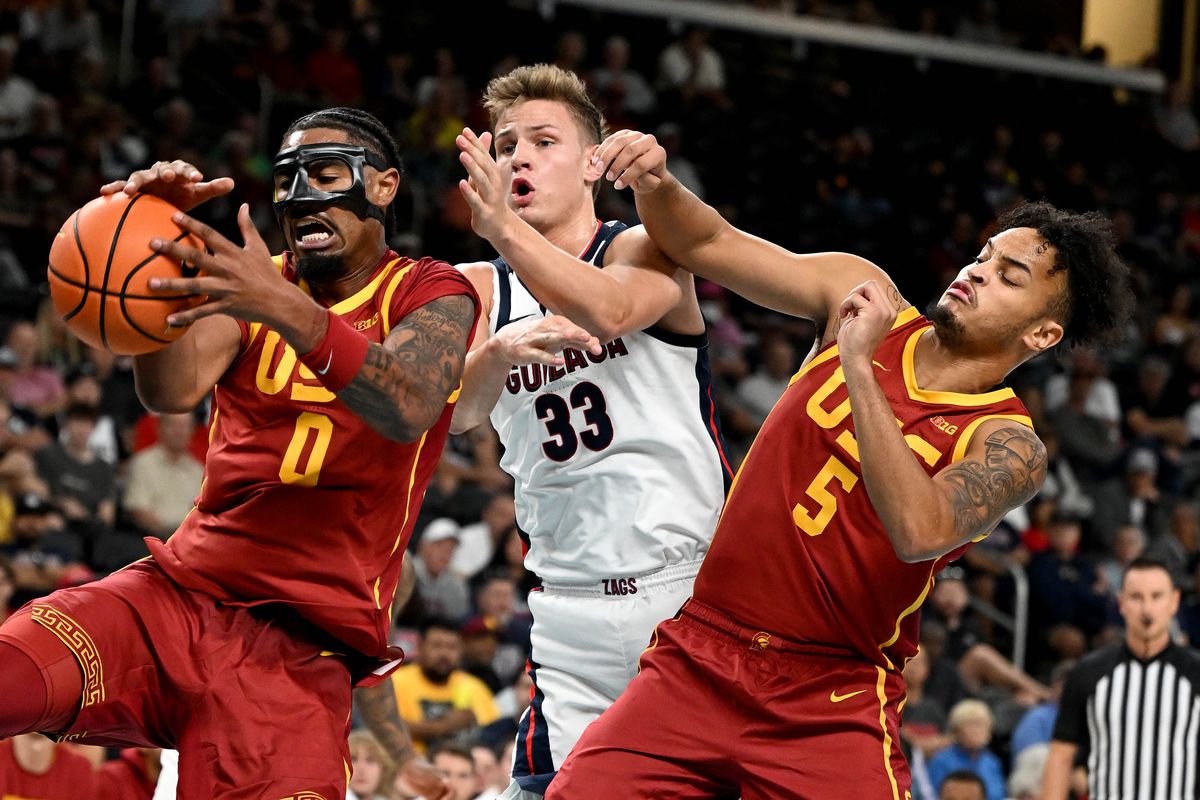 USC forward Saint Thomas (0) grabs a rebound away from Gonzaga forward Ben Gregg (33) as USC forward Terrance Williams II (5) reaches in during a college exhibition basketball game, Sat. Oct. 26, 2024, at the Acrisure Arena in Palm Desert.  (COLIN MULVANY/THE SPOKESMAN-REVIEW)