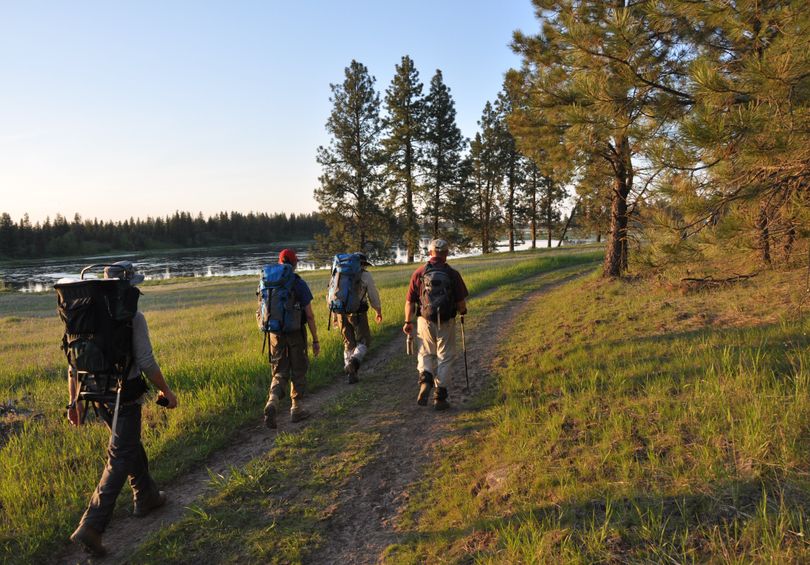 The Slavin Conservation area, like many of the areas preserved by the Spokane County Conservation Futures Program, are close to Spokane, enabling visitors such as these Spokane Mountaineers, to make quick visits even on weekday evenings after work.  (Rich Landers)