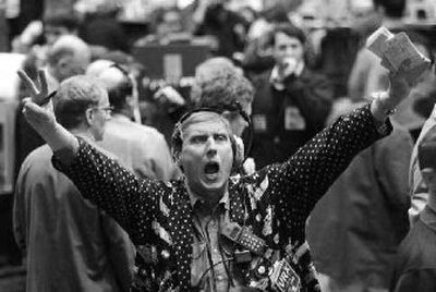 
Vernon Huls offers a sale on the agricultural trading floor at the Chicago Board of Trade. IntercontinentalExchange Inc. on Thursday made an unsolicited $9.9 billion all-stock bid for commodities exchange CBOT Holdings Inc. 
 (File Associated Press / The Spokesman-Review)