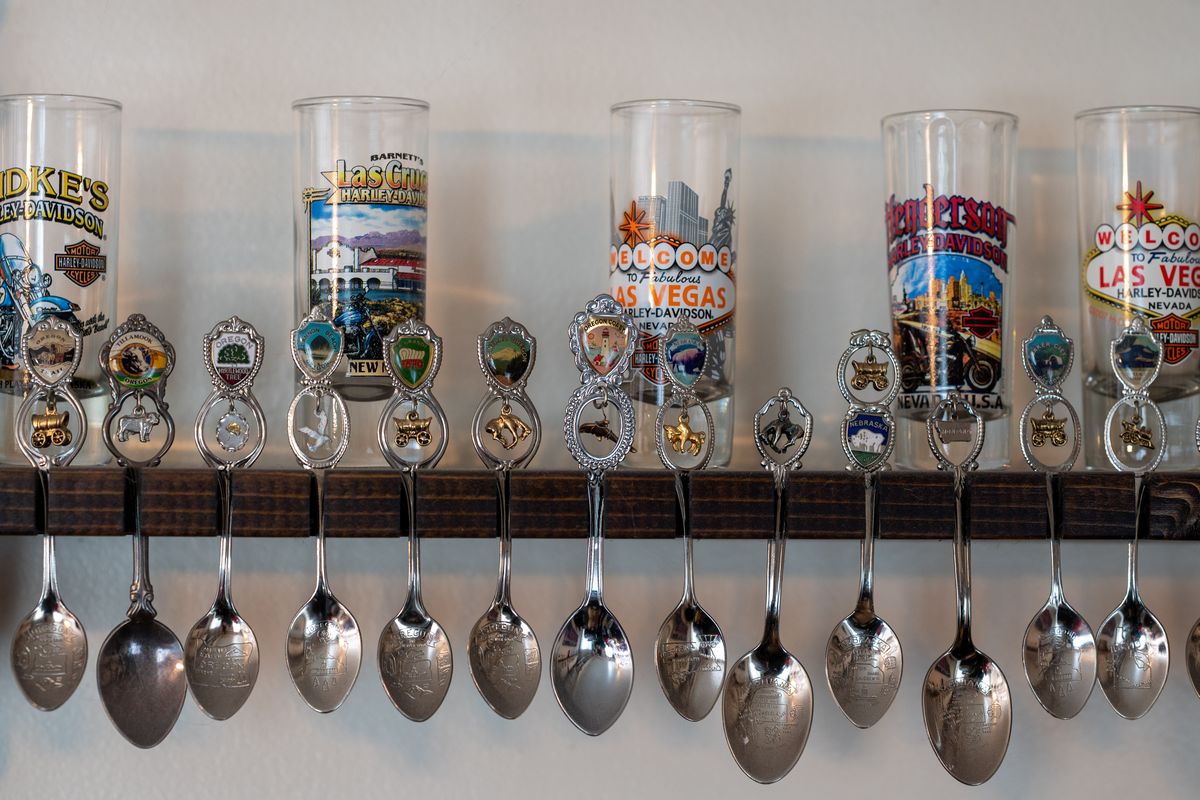 John Gamuer has collected 100 Harley Davidson themed shot glasses from Harley dealerships across the country. While he was doing that his late wife collected spoons and he still has all 1,700 of them displayed throughout his Hillyard home.  (COLIN MULVANY/THE SPOKESMAN-REVIEW)