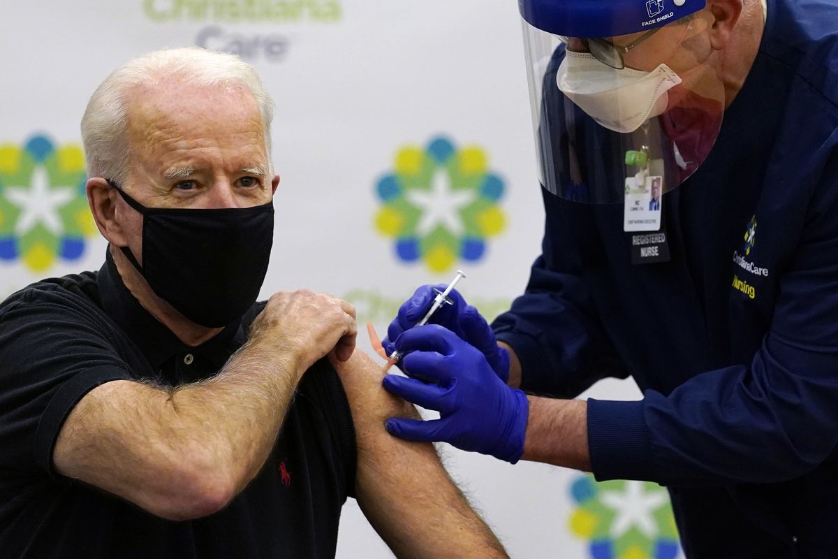 President-elect Joe Biden receives his second dose of the coronavirus vaccine at ChristianaCare Christiana Hospital in Newark, Del., Monday, Jan. 11, 2021. The vaccine is being administered by Chief Nurse Executive Ric Cuming.  (Susan Walsh)
