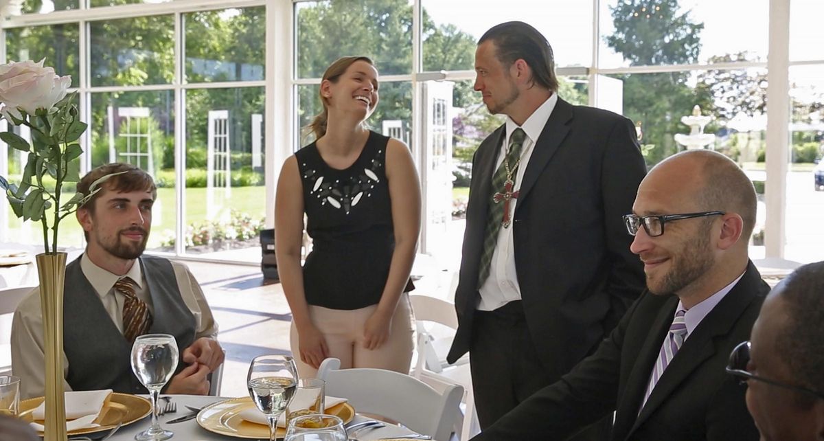 Sarah Cummins talks with men from Wheeler Mission, at the Ritz Charles, Saturday, July 15, 2017. Cummins called off her wedding which was supposed to be this day. She decided to bring purpose to her pain by inviting area homeless to enjoy the reception. (Kelly Wilkinson / Indianapolis Star)