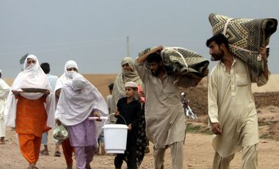 New refugees who have fled from fighting in Swat Valley arrive at the Jalozai camp in Peshawar, Pakistan, on Monday.   (Associated Press / The Spokesman-Review)